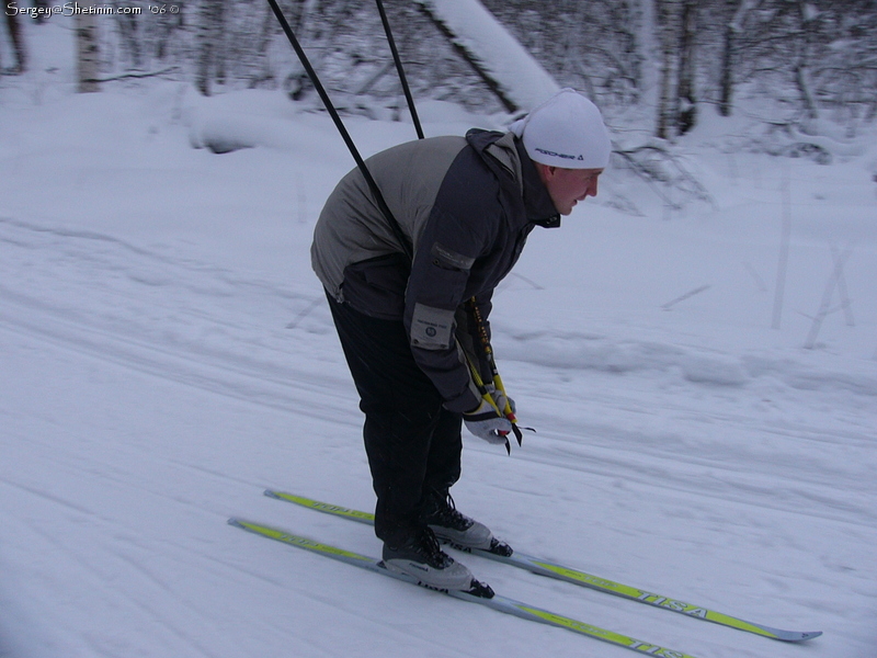 Dmitry is skiing down.