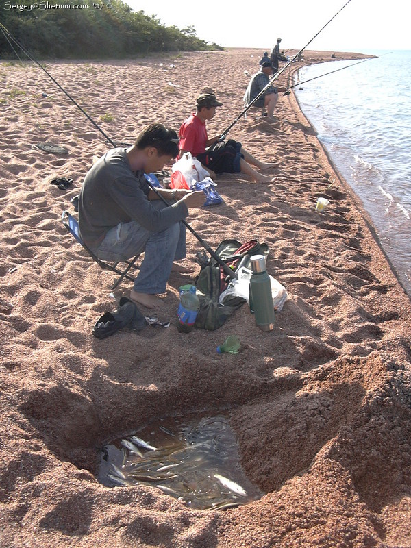 Issyk-Kul Lake fishing. Along the shore.