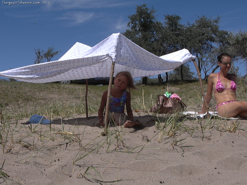 Lyuba at the beach under the roof