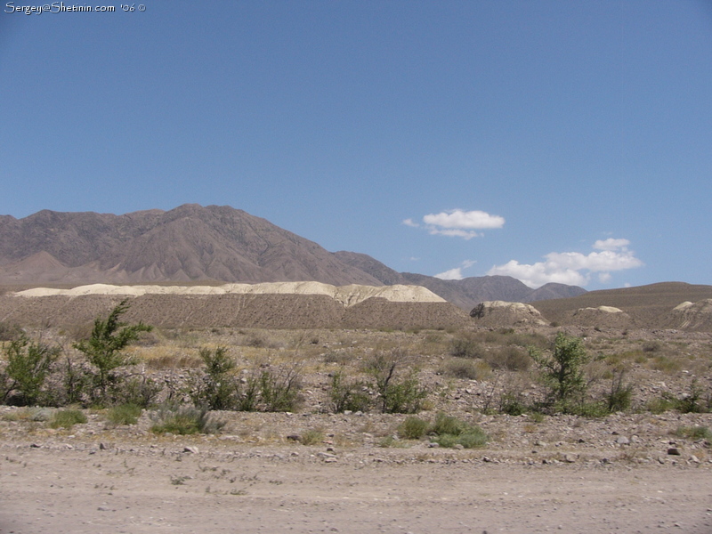 The road Bishkek - Karakol. Rybachye. Cholpon-Ata in 100 km. Last view of Boom mountains.