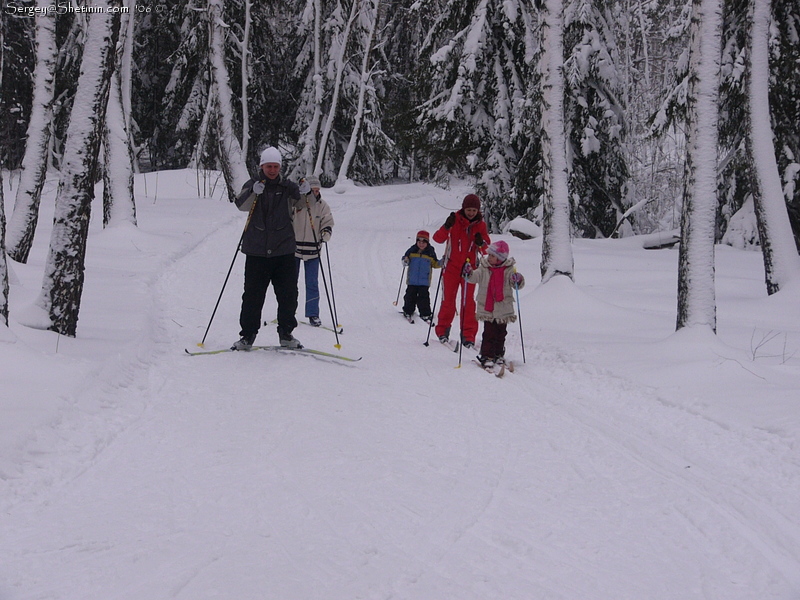 On ski-track after passing some skiers.