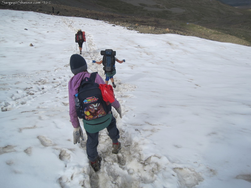 Girls are crossing snow field