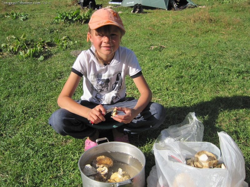 Lyuba is preparing mushrooms for cooking at Altyn Arashan