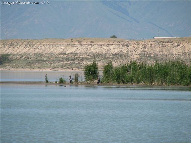 Fishermen on the other side of bay.