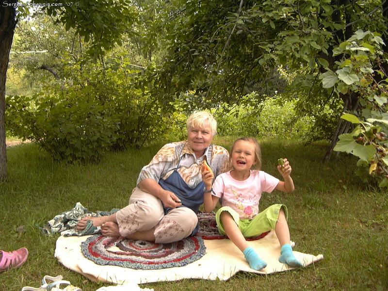 Lyuba and my mother in the garden.