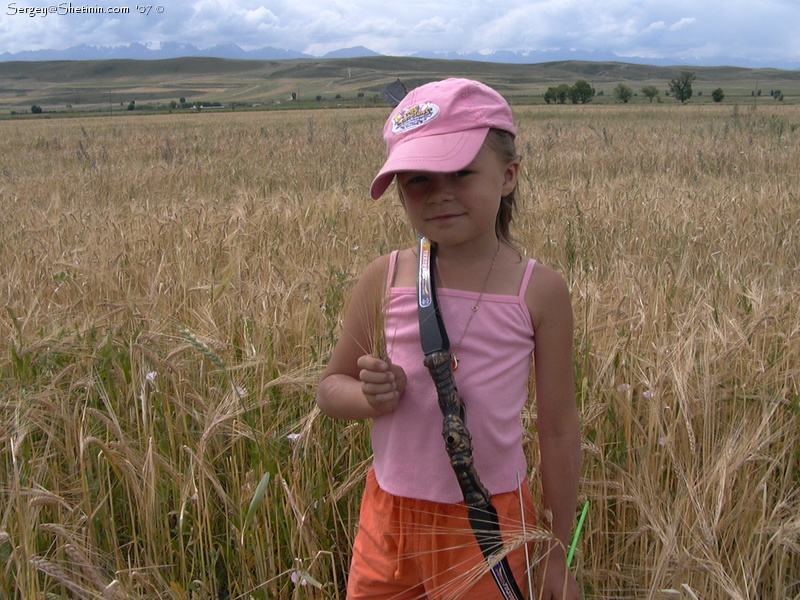 Lyuba and wheat-barley field
