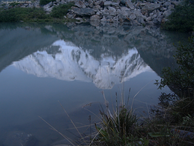 Peak Karakol reflection in the lake.