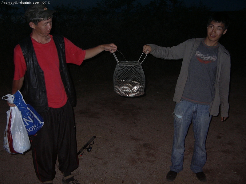 Ruslan and Azatbek with our caught fish. Issyk-Kul Lake.