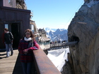 There is no place without tourists in Europe.At photo: Zhana against a background of the entry to the tunnel which has a lift to the very top of Aiguille-du-midi peak.