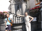 Famous place of Belgium, Brussels - "Pissing Boy" (Manneken Pis). The man near me trying to look similar as boy.