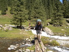 Crossing the river flowing from the valley where peak Ayu-Tor is situated.