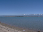 Great weather, excellent photo view of Issyk-Kul Lake and eastern part of Terskey Ala-Too range. Left side of photo, far away - Peak Tashtanbek, middle - Peak Prjevalsky, right - Peak Karakol 5216 m - the highest peak of the range.