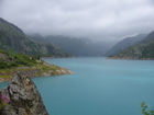 The lake is changing the colour of water depending on current weather. Sun - emerald colour, clouds - grey colour...