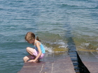 While it was not good to swim, we allowed Lyuba to dangle her legs in the water sitting on the old pier.