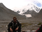 We left the glacier behind us and decided to have some rest and discuss about where should we set our camp for tonight. At photo: Quentin against a background of Karakol Peak.