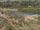 Misha and Irina are picking Thyme - very good hern to add to the tea. The 'city' beach is behind of them full of people swimming in this hot day.