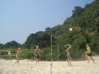 Sasha and Olya, Sergey and Lyuba are playing beach volleyball on the sand of Koh Rin island.