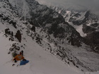 This is our camp at the pass Terimtor 4000 m above the sea level. We set our tents just on the pass ridge because all other places were under the big amount of wet snow.There is a small piece of Ala-Kul Lake is on the picture if you look to the right part.We're going to go back down to "Sirota" refuge. Peak Prjevalsky with its summit is for other time, when the weather will be better (we didn't know yet that the weather will be like this almost all the days)