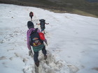 Ainura, Larisa and Lyuba moved forward crossing snow field that met us under the pass Ala-Kul in the shadow side.