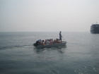 We used the small boat to get to the shore of Koh Rin Island. Girls were in the first group of people transferred to the beach.