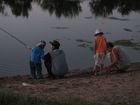 At evening time we arrived to the pond situated on the territory of Mikhailovka dachas. Spent there one hour, feeded gnats, didn't catch somthing and went back to home. At photo: Ruslan and his son, me and Lyuba.