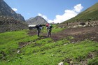 There was a shepherd's camp in the place where we should cross a river. Askhat and Volodya found some big piece of salt and discussed why it was here.