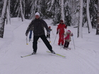 Before the long descending from the hill Dima shot ahead to see the situation. There could be many fallen skiers and children at the end of descending, so Dmitry went to check it.