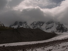 We reached the point where we could see Djigit peak bottom. The summit of the peak was under the clouds. From this point we saw a lot of snow on the slopes of the peak and on the route we planned to go.