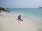 Lyuba is on the beach of Koh Rin island. The rocks under water nearby were full of fish and that was interesting to do snorkelling there.