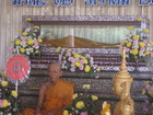 The enbalmed body of monk in the glass shell. The wax body in front of the sarcophagus shows how monk was looking when he was alive. This place is called Wat Ham Seh - and the famous with the cave where monk found the tiger and then lived there.