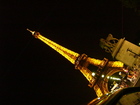 Eifel Tower is lighted up in the night and it's looking very charming.