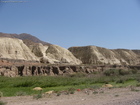 This is a view of sandy/clay small mountains near Balykchy town when you exiting from Boom canyon. Balykchy town has a few other names before ('Rybachye' - in the former USSR times, and 'Issyk-Kul' after USSR was broken).