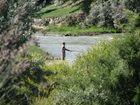 Azat did many interesting shots this day. After Ruslan caught one 'osman' we were going along the river Karakol with hope to catch more. At photo: Ruslan trying new deep on Karakol river to find more fish.