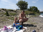 Happy after swimming in Issyk-Kul Lake.. After swimming we sat at coverlet to warm ourselves on the sun.