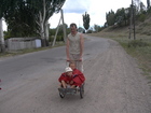 One day we decided to go to local cemetery to visit our relatives and children found a wheelbarrow in the garden and I was obliged to be driver this day for them. At photo: Stas and Lyuba in the wheelbarrow and I'm as a driver.