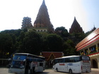 This is the view from bus parking. The temple of Tiger Wat Ham Seh to the right, anf teh Temple of cave on the hill Wat Tham Khao Noi by the strairs up to towers. Kanchanaburi province. Thailand