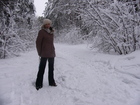 At the photo: Zhanna is standing on the trail in the forest.