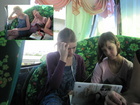 Girls in the bus. First they started to watch some movie but then fell asleep.