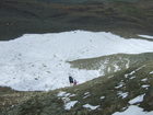 After deep scree of Ala-Kul pass we should cross the snow field and then our way will be more flat and dry.