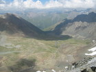 The view from Ala-Kul pass to valley where we set up our next camp. We just need to go down from the pass carefully, around the snow, fins a first clear water and flat place for tents. Arashan valley is still far away but we need rest and don't go any further today.